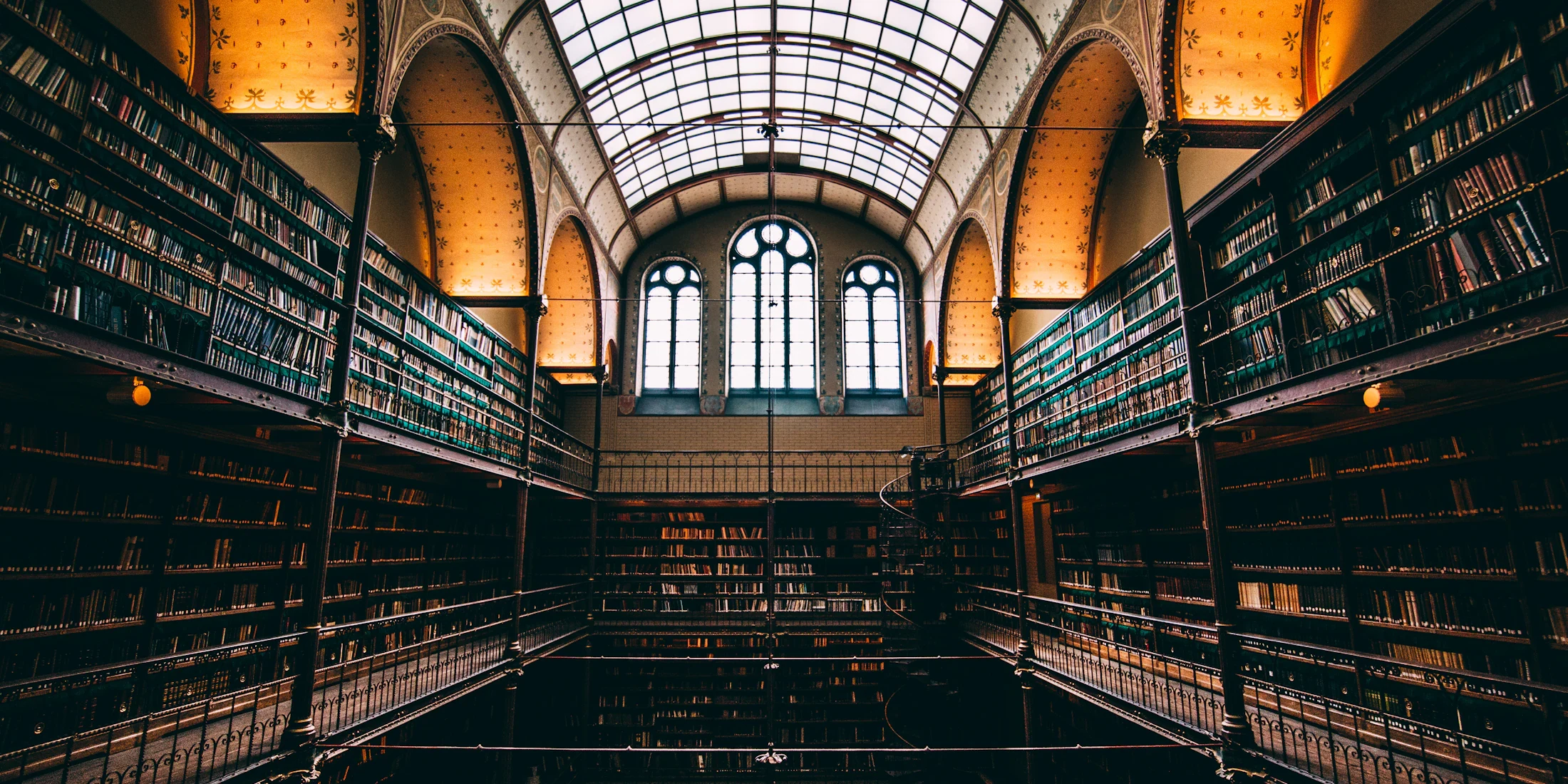 Rows of bookshelves in a grand library hall