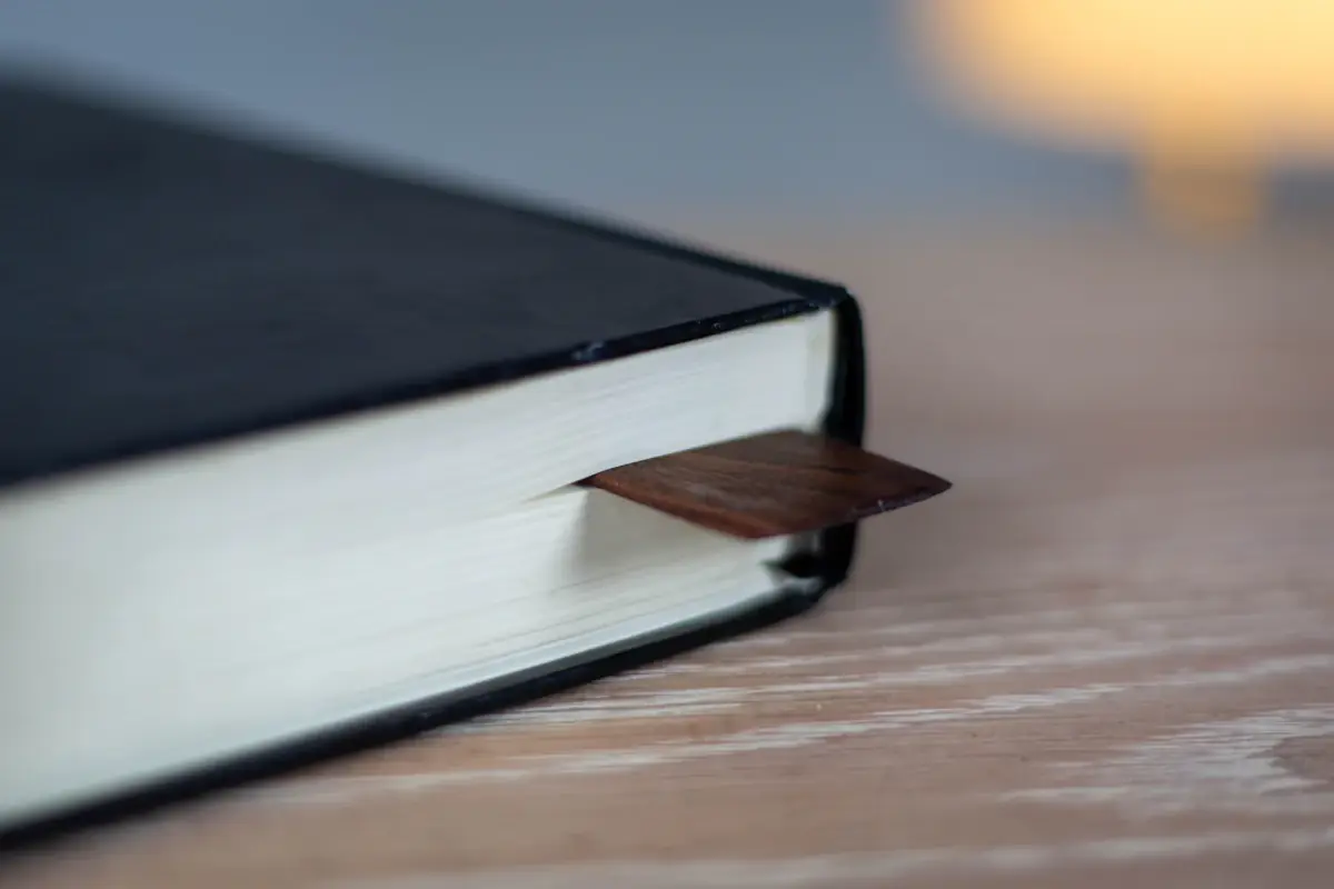 A finished clothbound hardcover with a ribbon marker